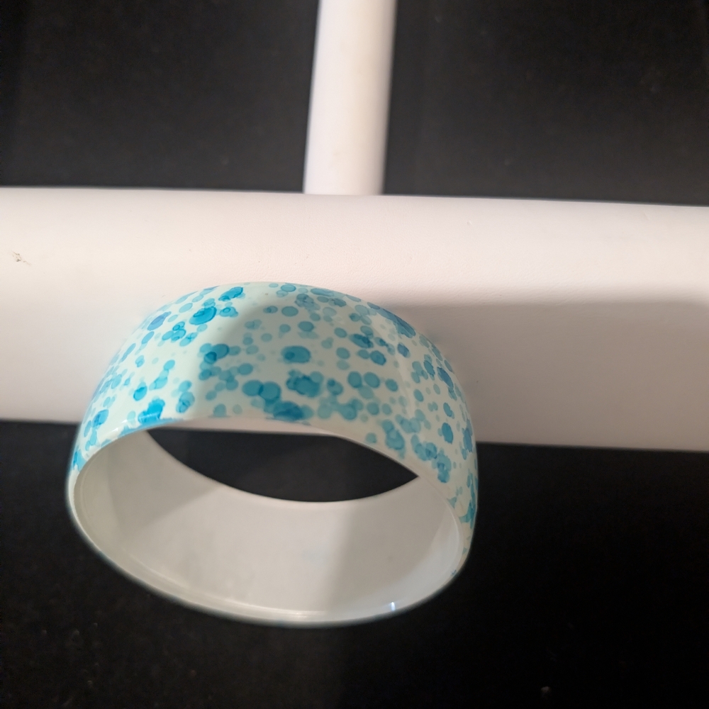 white and blue speckled bangle bracelet